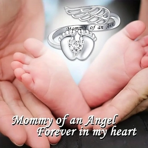 Detailed close-up of ring engraving Mommy of an Angel with baby footprints and heart zircon