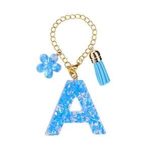 Detail view of blue sequin resin initial A keychain with matching tassel and gold hardware