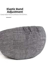 Detail view of the gray textured beret cap showing the elastic adjustable strap system