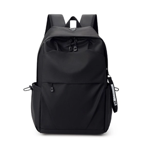 Large capacity black nylon backpack for laptops and travel featuring a minimalist design