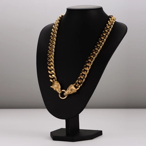 Golden stainless steel Cuban chain necklace with detailed Viking wolf heads and O-ring clasp