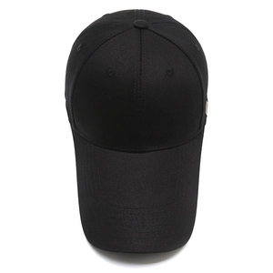 Classic black cotton baseball cap with long visor and small brown side label on white background