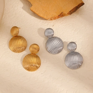 Minimalist double sphere geometric earrings with gold and silver striped texture
