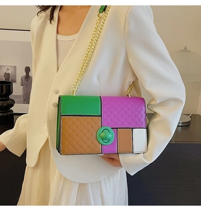 Close-up of color-block chain handbag with green, purple, and brown quilted faux leather