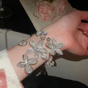 Elegant multi-layer open flower bracelet with sparkling crystals and butterfly design