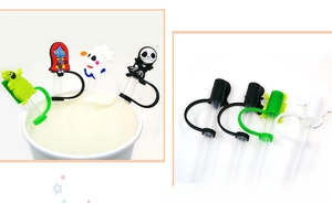 Detailed view of Halloween themed silicone straw covers featuring spooky cartoon designs
