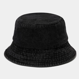 Close-up detail of reinforced stitching on black washed denim bucket hat brim