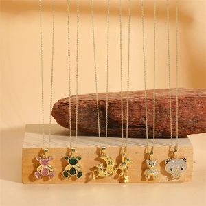 Gold necklaces featuring emerald zircon bear pendants and moon love engraving charms