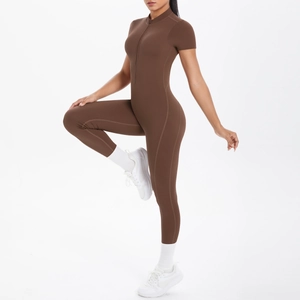 Detail view of brown short sleeve yoga unitard with front zipper and stand collar design