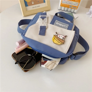 Close-up of Japanese style canvas crossbody bag showing inner storage capacity and decor