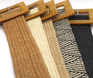 Detail view of woven stretch belts with square resin buckles in five bohemian colors