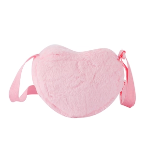 Detailed view of pink heart-shaped plush crossbody bag with soft faux fur texture