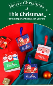 Detailed view of colorful Christmas gift boxes with festive ribbons and Santa illustrations