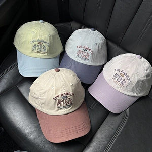 Detailed embroidery of cartoon evil rabbits on various color-block cotton baseball caps