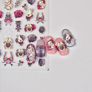 Detail of gothic embossed nail stickers with dark rabbits, roses and lace bow designs