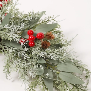 Christmas door swag with frosted cedar, red berries, pinecones and eucalyptus leaves