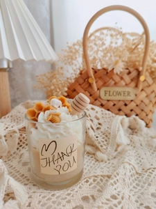 Detailed close-up of strawberry chocolate scent candle with honey dipper and honeycomb wax