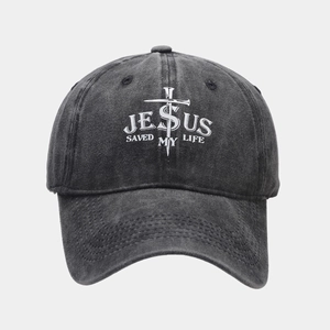 Close-up of Jesus Saved My Life print on washed denim baseball cap with cross detail