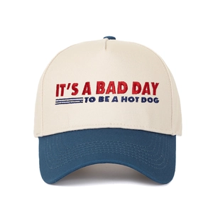 Detail of embroidered text It's a Bad Day to Be a Hotdog on two-tone baseball cap
