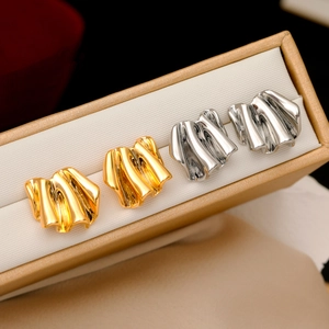 Irregular geometric pleated earrings in gold and silver finish on display box
