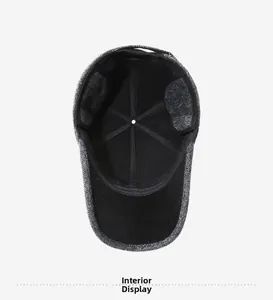 Interior view showing the thick black fleece lining of the grey herringbone winter cap