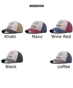 Detail view of cotton baseball caps with distressed brims and skull prints in five colors