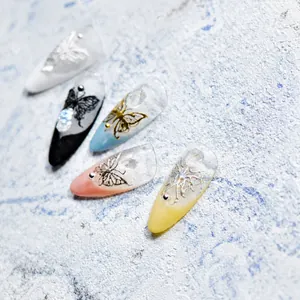 Detailed 3D butterfly nail art stickers with elegant French style patterns on stone surface