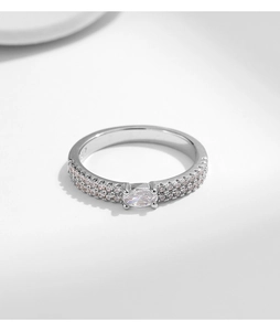 Close-up of double-layered silver ring with pavé zircons and oval center stone