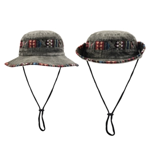 Detailed view of ethnic style bucket hats with adjustable chin straps for outdoors