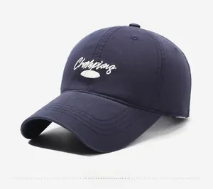 Detail of navy cotton baseball cap featuring vintage 1989 embroidery and white lettering