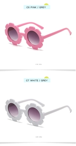 Detailed view of pink and white flower-shaped sunglasses for kids with round lenses