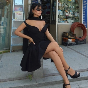 Detail view of black V-neck short dress with slim waist and halter neck design