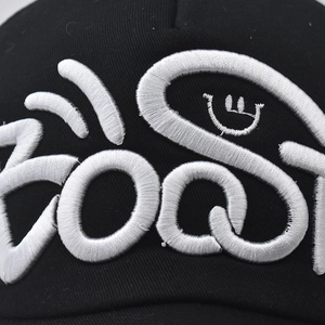 Black washed cotton baseball cap featuring 3D white GOOST embroidery and smile icon