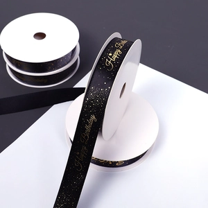 Black satin ribbon with gold Happy Birthday foil print for gift wrapping and cake decoration