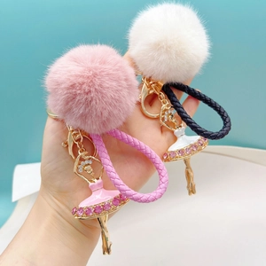 Handheld rhinestone ballet girl keychain with faux fur ball and woven rope pendants