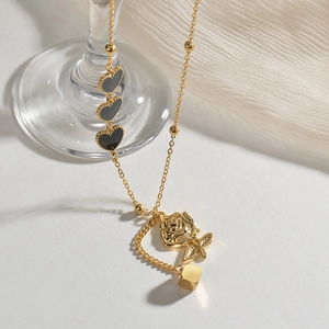 Gold stainless steel necklace featuring black heart pendants and a rose flower charm