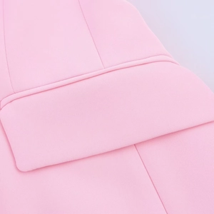 Close-up of pink fabric texture with detailed stitching and premium woven material