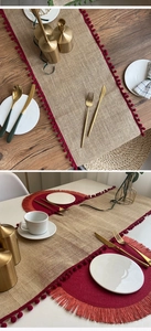 Close-up of jute table runner with red pom pom edges and matching tassel placemat