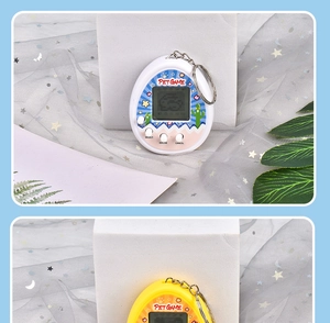 Miniature white and yellow virtual pet consoles shown as cute keychains with charms