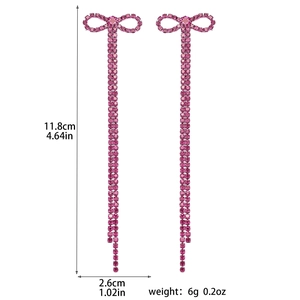 Detail showing pink rhinestone bow earrings dimensions 11.8cm length and 2.6cm width