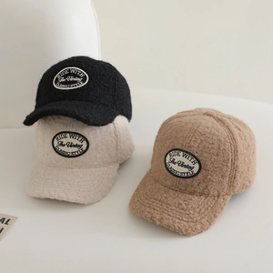 Detailed close-up showing soft sherpa wool texture and vintage embroidery on baseball caps
