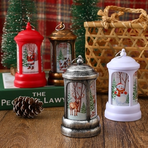 Close-up of vintage Christmas LED lanterns with Santa, snowman, and reindeer designs.