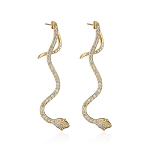 Snake shaped 18K gold plated earrings with sparkling zircon stones on white background