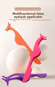Close-up of colorful ergonomic stainless steel eyelash tweezers in orange, pink, and purple