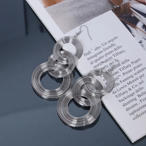 Silver geometric multi-layered round circle drop earrings with a metallic finish