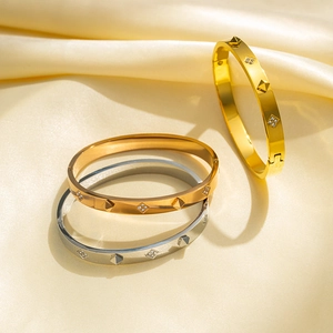 Three crystal clover stainless steel bracelets in gold, rose gold and silver on silk