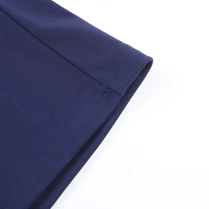 Close-up detail of double-stitched hem and fine texture on navy blue knitted dress