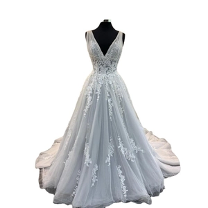 Elegant V-neck light blue lace wedding gown with floral embroidery and layered tulle skirt