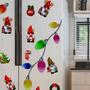 Christmas gnome and colorful bulb magnetic stickers displayed on a white refrigerator