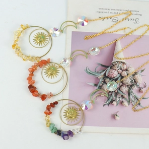Golden sun and moon suncatcher set with colorful crystal chips for outdoor window decor
